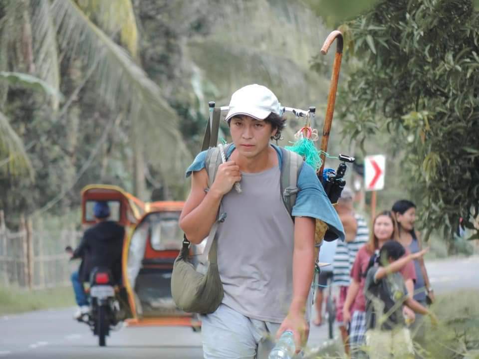 Japanese Artist Walks Panay Island Pulling Tire